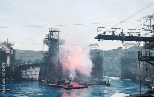 SINGAPORE, Universal Studio:  Water Stunt Show called Waterworld : A Live War Spectacular at Universal Studios in Singapore. Explosions, special effects and smoke.
