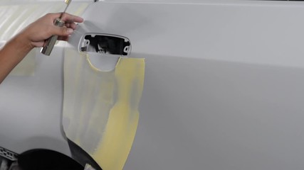 Wall Mural - Auto body repair series: Applying putty