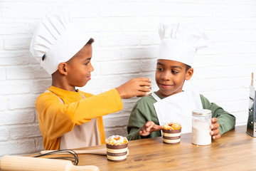 Wall Mural - Two African American brothers kids dressed as chef