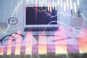 Stock market graph and table with computer background. Double exposure. Concept of financial analysis.