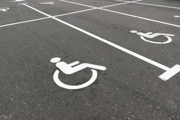 Road marking on the asphalt with parking spaces for the disabled