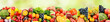 Fruits, vegetables and berries on green blurred background