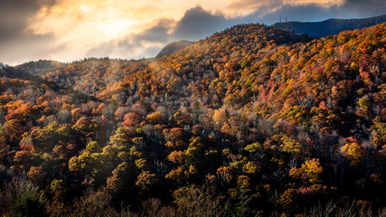 Dramatic sunset with sun rays in Blue Ridge Parkway during the Golden Hour