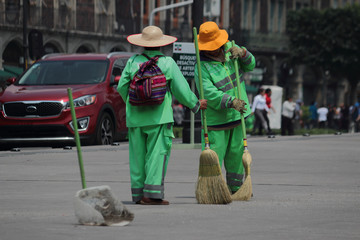 Street sweeper during his work day in the pinth of the city.