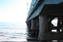 Pylons Bearing A Pier On The Sea