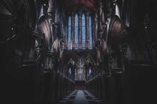 GLASGOW, SCOTLAND, DECEMBER 16, 2018: Magnificent Perspective View Of Interiors Of Glasgow Cathedral, Known As High Kirk Or St. Mungo, With Huge Stained Glasses. Scottish Gothic Architecture.