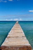Fototapeta Most - A wooden pier at Playa de Muro beach in Mallorca