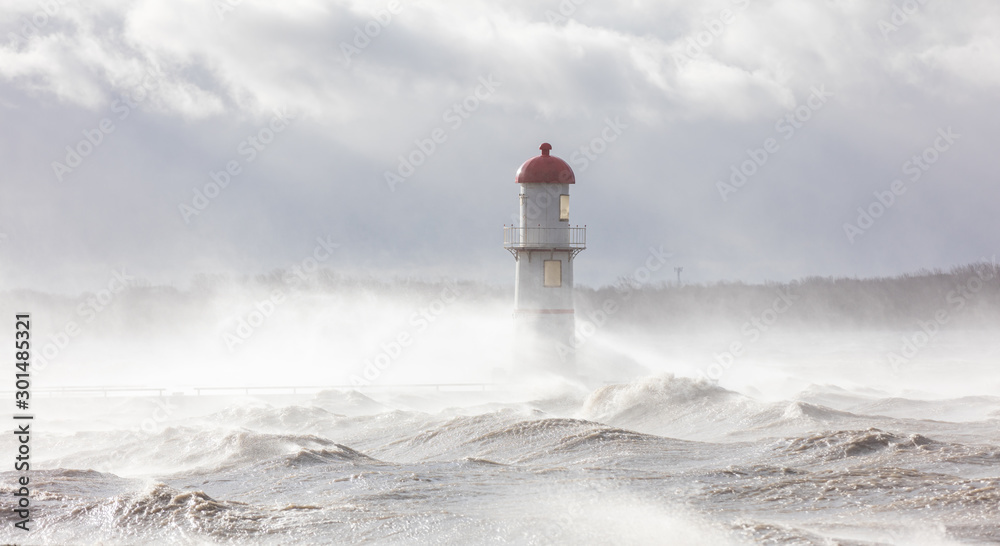 Lachine lighthouse being battered by a storm in early November, Quebec, Canada. - obrazy, fototapety, plakaty 