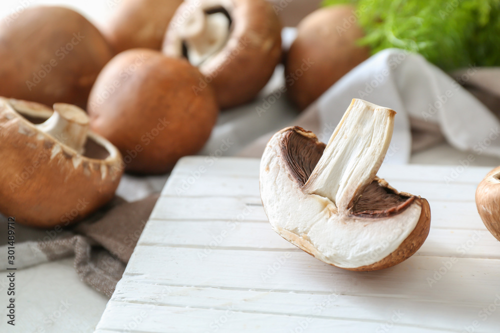 Fresh champignon mushrooms on table