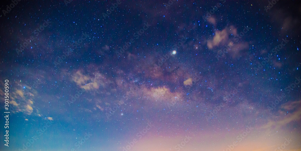 Panorama blue night sky milky way and star on dark background.Universe filled, nebula and galaxy with noise and grain.Photo by long exposure and select white balance.Dark night sky. - obrazy, fototapety, plakaty 