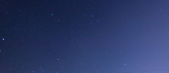 Panorama blue night sky milky way and star on dark background.Universe filled with stars, nebula and galaxy with noise and grain.Photo by long exposure and select white balance