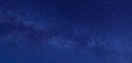panorama blue night sky milky way and star on dark background.universe filled with stars, nebula and