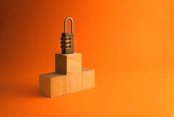 Combination padlock  isolated on orange background. Business to success concept.