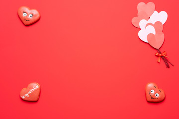 Wall Mural - Valentine's day red background with heart shape decorations, gift and ribbons. View from above. Flat lay composition