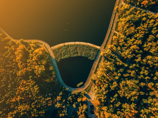 Wall Mural - Amazing iamge from above taked with drone, beautiful nature landscape with lake and green forest at sunset