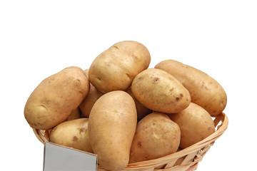 Wall Mural - New potatoes are in a basket on the counter of the farmers ' market. The latest hybrid varieties of potatoes.