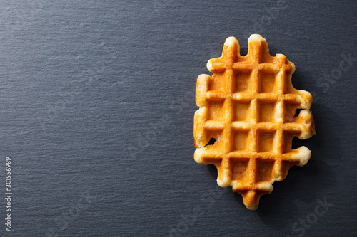 Fotomural Belgian waffle. Slate background. Copy space. Top view.