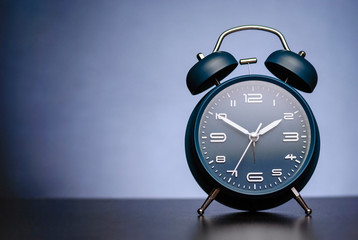 Wall Mural - traditional alarm clock with bells on blue
