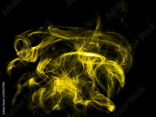 Cuadros en Lienzo Yellow smoke on black background