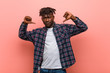 © Asier - Young african black man feels proud and self confident, example to follow.
