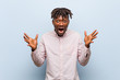 © Asier - Young business african black man celebrating a victory or success