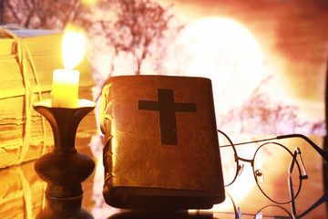 Canvas Print - Vintage glasses on an old retro book on a background of the moon. Reading a book by candlelight. The concept of book thrillers and novels.