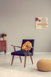 © Photographee.eu - Yellow knot pillow on trendy vintage armchair in empty room