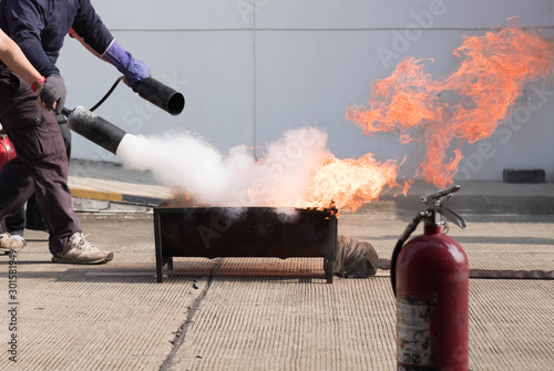 The instructor demonstrate and training the fire extinguisher use, fire evacuation and fire fighting training.