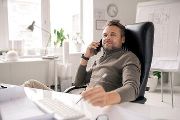 Poster - Serious mature businessman or agent consulting clients by desk in office