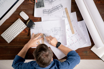 Aufkleber - Overview of busy engineer with ruler and pencil drawing line on sketch