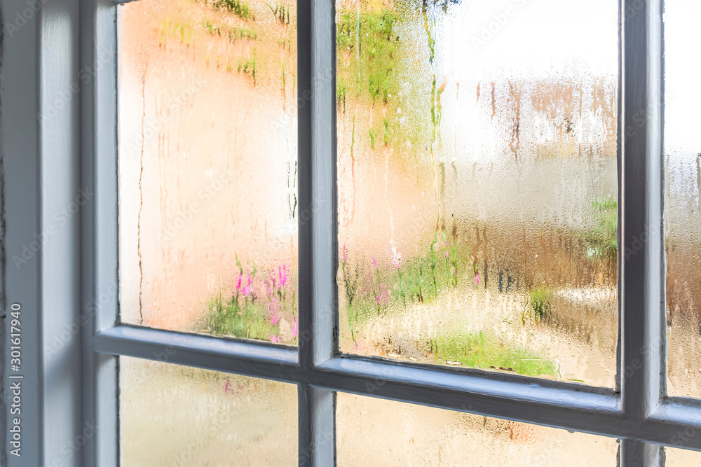 Condensation on an old window of a home - obrazy, fototapety, plakaty 