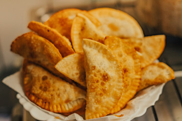 frying homemade pastries at home, brazilian cultural salty food