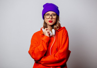 Poster - Style girl in orange hoodie and purple hat with headphones