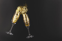 Creative Shot Of Two Champagne Glasses And Confetti. Christmas, New Year Celebration Concept.