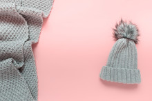Warm Winter Wardrobe Handmade Hat Beanie With Pompom And Knitted Large Scarf On Pink Background. Photo With Copy Blank Space In The Center Of Image.