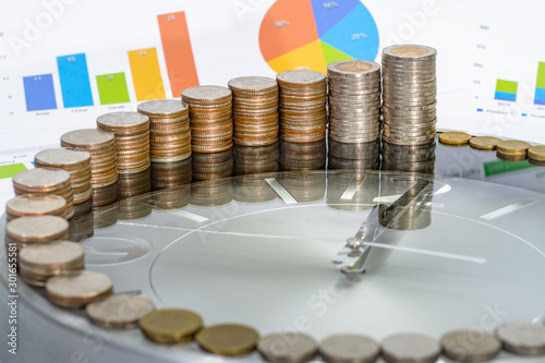 Fotomural Money stack step up growing growth saving money on clock Concept financial business investment