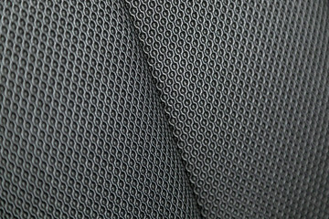 Wall Mural - Part of   car headrest seat details. Сlose-up black perforated   textile car seat. fabric texture