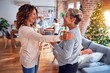 © Krakenimages.com - Family and friends dining at home celebrating christmas eve with traditional food and decoration, women talking together happy and casual