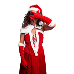 Middle age woman wearing Santa Claus costume peeking in shock covering face and eyes with hand, looking through fingers with embarrassed expression.