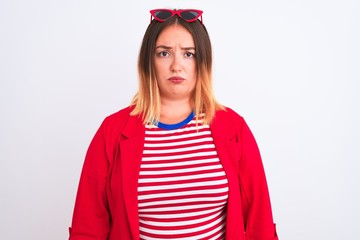 Sticker - Young beautiful woman wearing striped t-shirt and jacket over isolated white background depressed and worry for distress, crying angry and afraid. Sad expression.