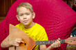© vitec40 - seven year old boy plays the balalaika