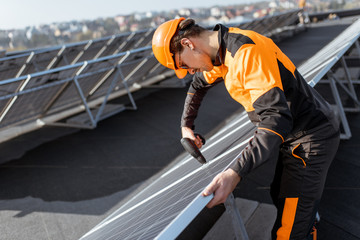 Wall Mural - Workman on the solar station