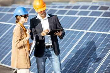 Wall Mural - business people on a solar power station