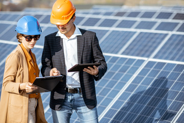 Wall Mural - business people on a solar power station