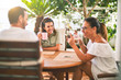 © Krakenimages.com - Beautiful family sitting on terrace drinking cup of coffee speaking and smiling