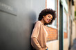 © mimagephotos - beautiful african american female fashion model leaning against wall
