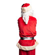 © Krakenimages.com - Middle age handsome man wearing Santa Claus costume and beard standing standing backwards looking away with crossed arms