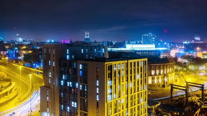 Poster - Liverpool, UK. Time-lapse of aerial view of night traffic in the center of Liverpool, England, UK with dark sky and illuminated buildings.