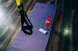 © BullRun - Fitness mat with bottle of water and smartphone