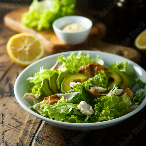 Cuadros en Lienzo Homemade Caesar salad with chicken and avocado